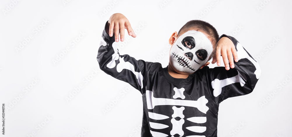 Halloween Kid. Child man horror face painting make up for ghost scary, Portrait of Asian little kid boy wearing skeleton costume studio shot isolated white background, Happy halloween day concept Halloween Kid. Child man horror face painting make up for ghost scary, Portrait of Asian little kid boy wearing skeleton costume studio shot isolated white background, Happy halloween day concept