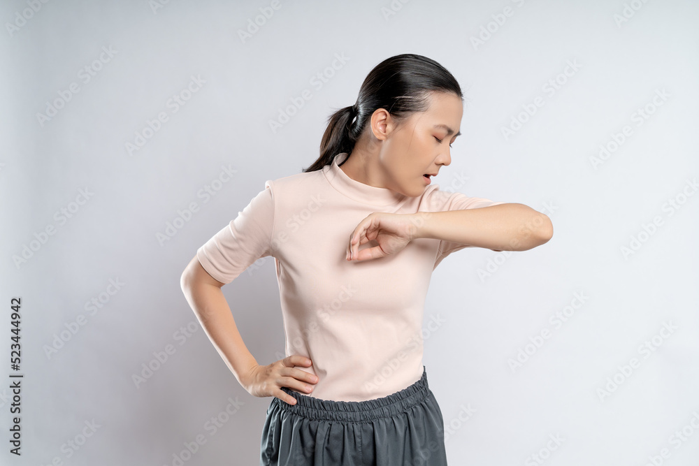 Asian woman was sick with sore throat standing isolated on white background. Asian woman was sick with sore throat standing isolated on white background.