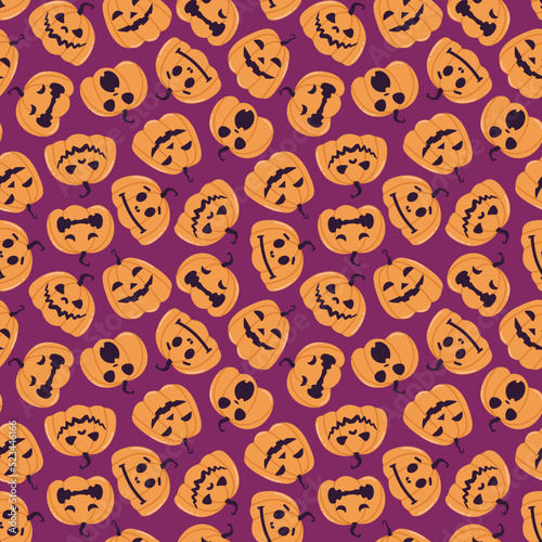 Seamless vector pattern with festive Halloween pumpkins. Jack orange lantern drawn with carved faces. Repeat tile swatch with orange icons on purple background for textile, wrapping paper, fabric