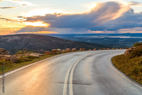 Sunset Coastal Highway - An Autumn sunset view of winding Cadillac Summit Road near top of Cadillac Mountain in Acadia National Park, Bar Harbor, Maine, USA.