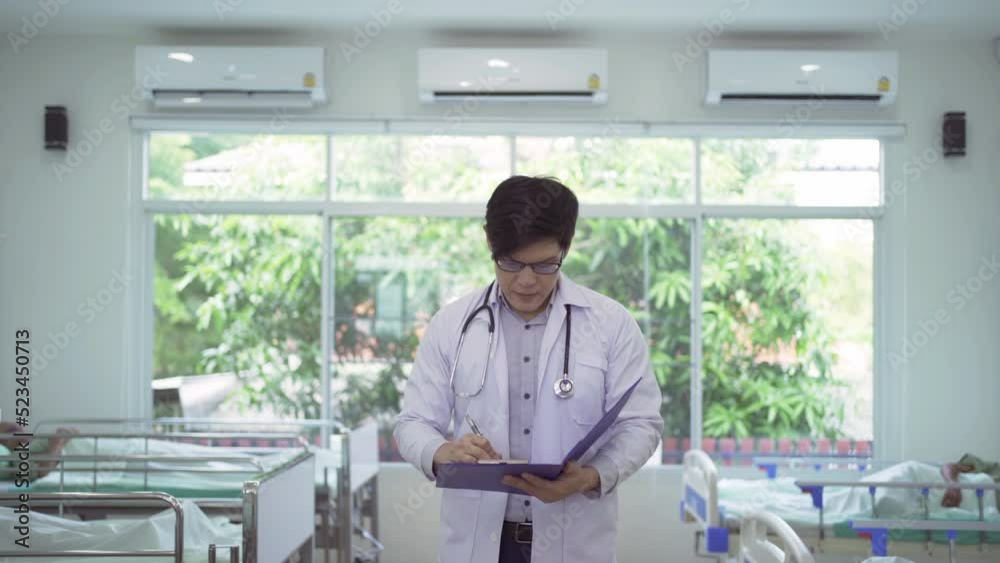 Portrait of an Asian doctor with group of old elderly patient or pensioner, in nursing home in hospital. Senior people lifestyle activity recreation. Health care physical therapy. Portrait of an Asian doctor with group of old elderly patient or pensioner, in nursing home in hospital. Senior people lifestyle activity recreation. Health care physical therapy.