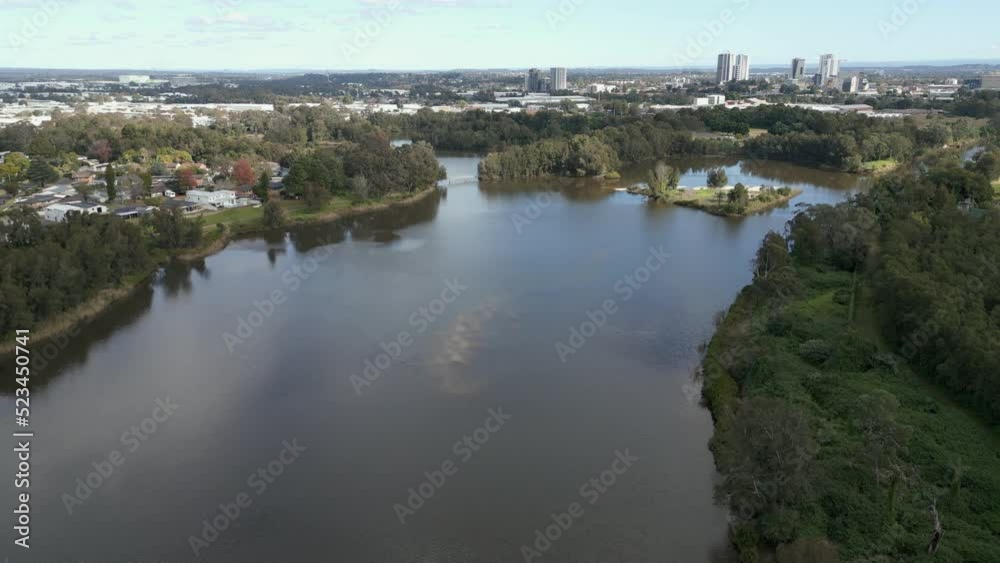 Aerial fly over Parramatta River with city skyline in the background. New South Wales, Australia. Cinematic drone shot Aerial fly over Parramatta River with city skyline in the background. New South Wales, Australia. Cinematic drone shot