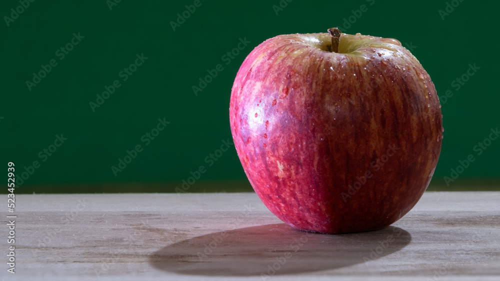 close-up photo of apple on the table close-up photo of apple on the table