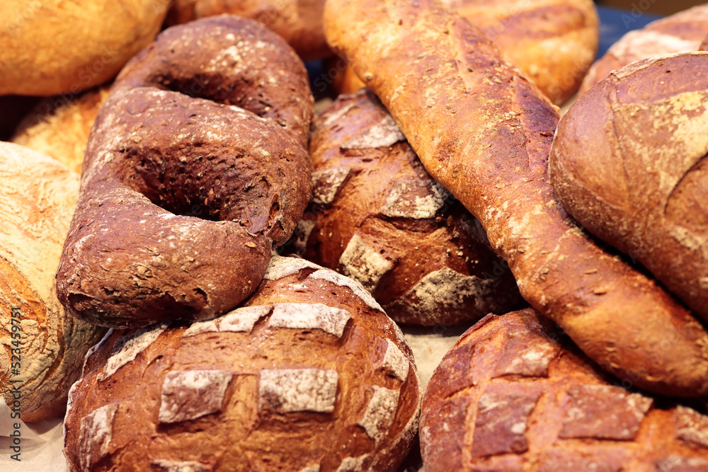 varied bread loaves on a bakery shop counter varied bread loaves on a bakery shop counter
