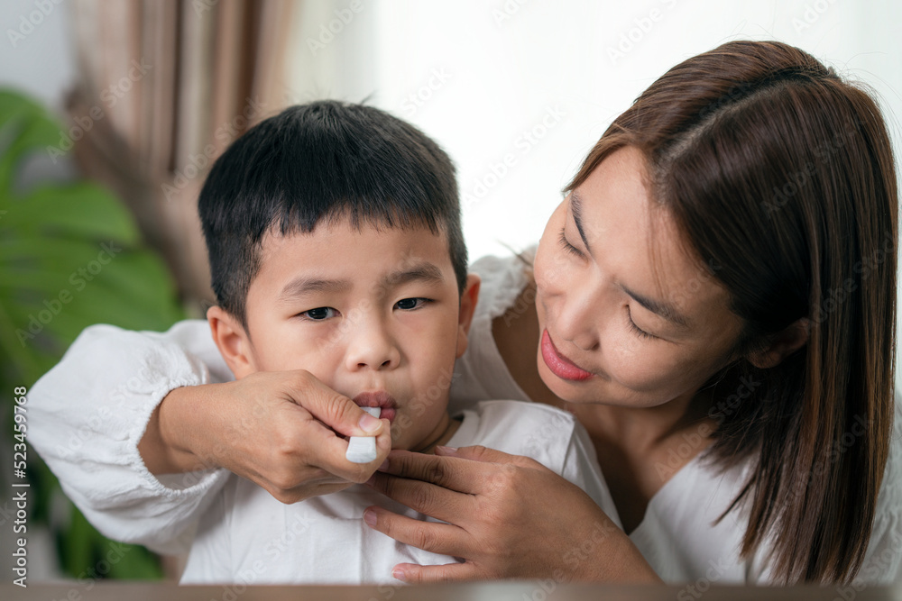 Mother test covid19 for her son with saliva ATK at they home Mother test covid19 for her son with saliva ATK at they home