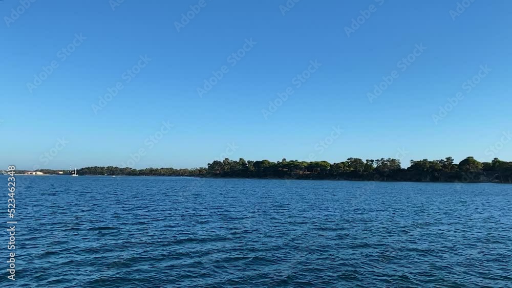 Leisure boat in Sado River, Troia Peninsula - Setubal, Portugal. Sunny day with blue sky Leisure boat in Sado River, Troia Peninsula - Setubal, Portugal. Sunny day with blue sky