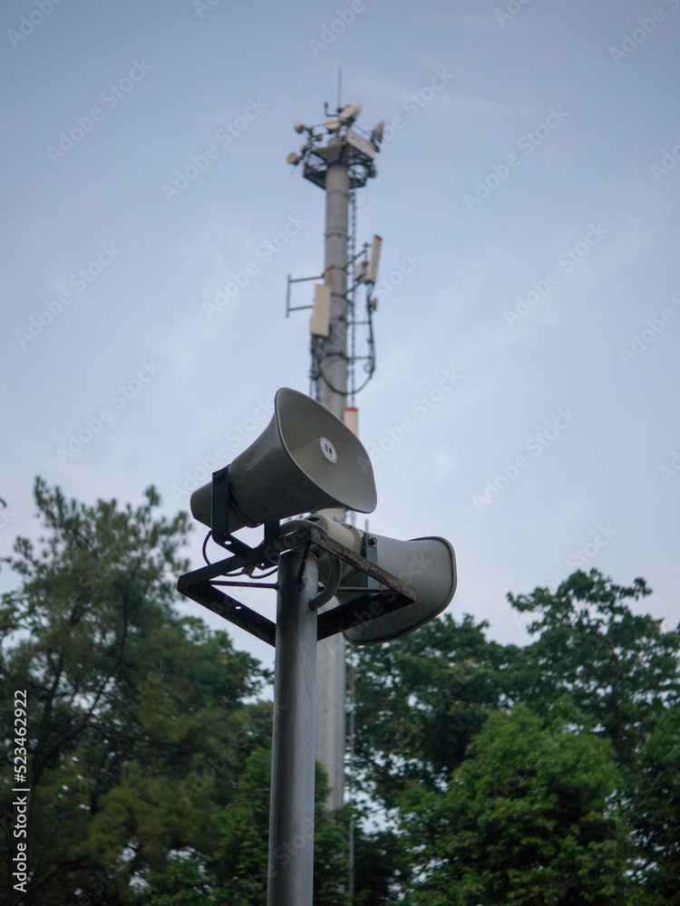 Horn speaker for public relations sign symbol on sky background Horn speaker for public relations sign symbol on sky background