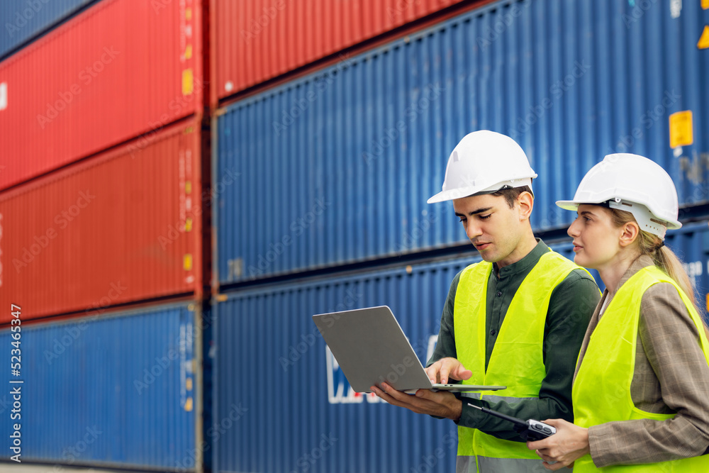 Logistics staff working togather in container storage area Logistics staff working togather in container storage area