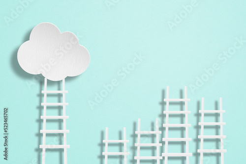 Business goal, strategy concept, white clouds paper cut with ladders on grunge green texture background