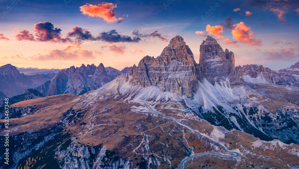 Violet sunrise in Tre Cime Di Lavaredo National Park. Fantastic morning view of Dolomite Alps, Auronzo location, Italy, Europe. Beauty of nature concept background.