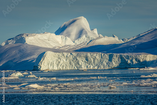 Close-up of icebergs in the mouth of the Illulisat icefjord in west Greenland photo