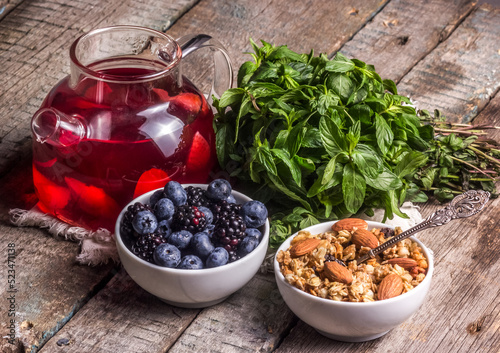 Muesli with almonds, berries and fruit tea