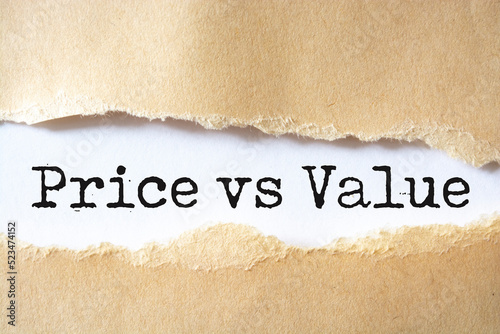 Torn brown paper revealing the words Price vs Value