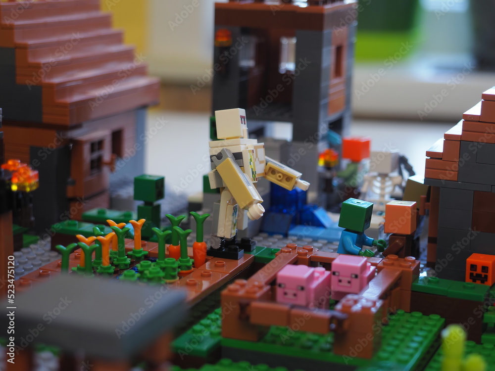 Fototapeta premium Elements and fragments of Lego village world set. Characters of electronic game Minecraft. Children's designer with small details, developing motor skills and imagination.