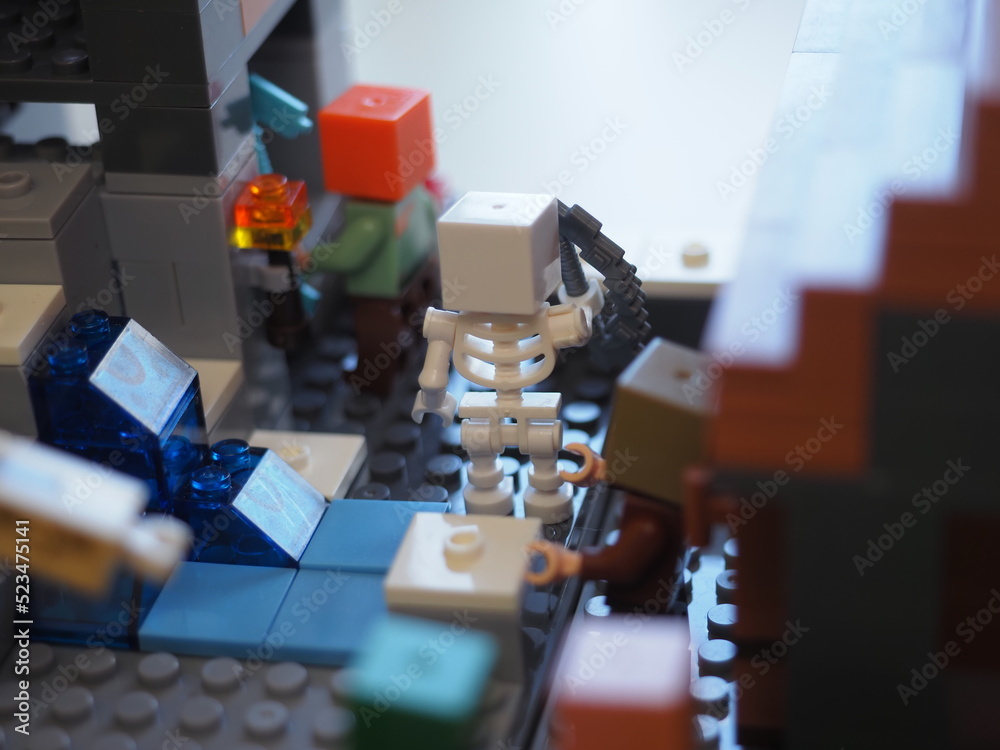 Naklejka premium Elements and fragments of Lego village world set. Characters of electronic game Minecraft. Children's designer with small details, developing motor skills and imagination.