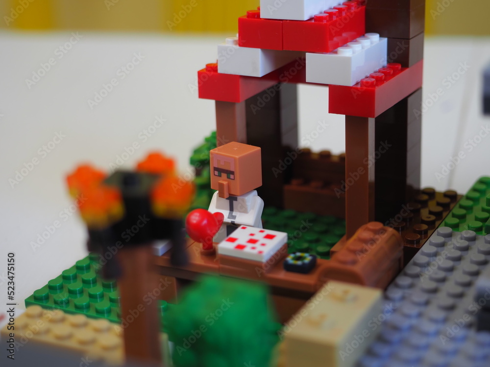 Obraz premium Elements and fragments of Lego village world set. Characters of electronic game Minecraft. Children's designer with small details, developing motor skills and imagination.