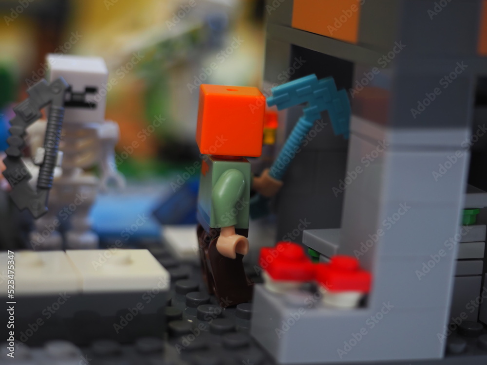 Fototapeta premium Elements and fragments of Lego village world set. Characters of electronic game Minecraft. Children's designer with small details, developing motor skills and imagination.