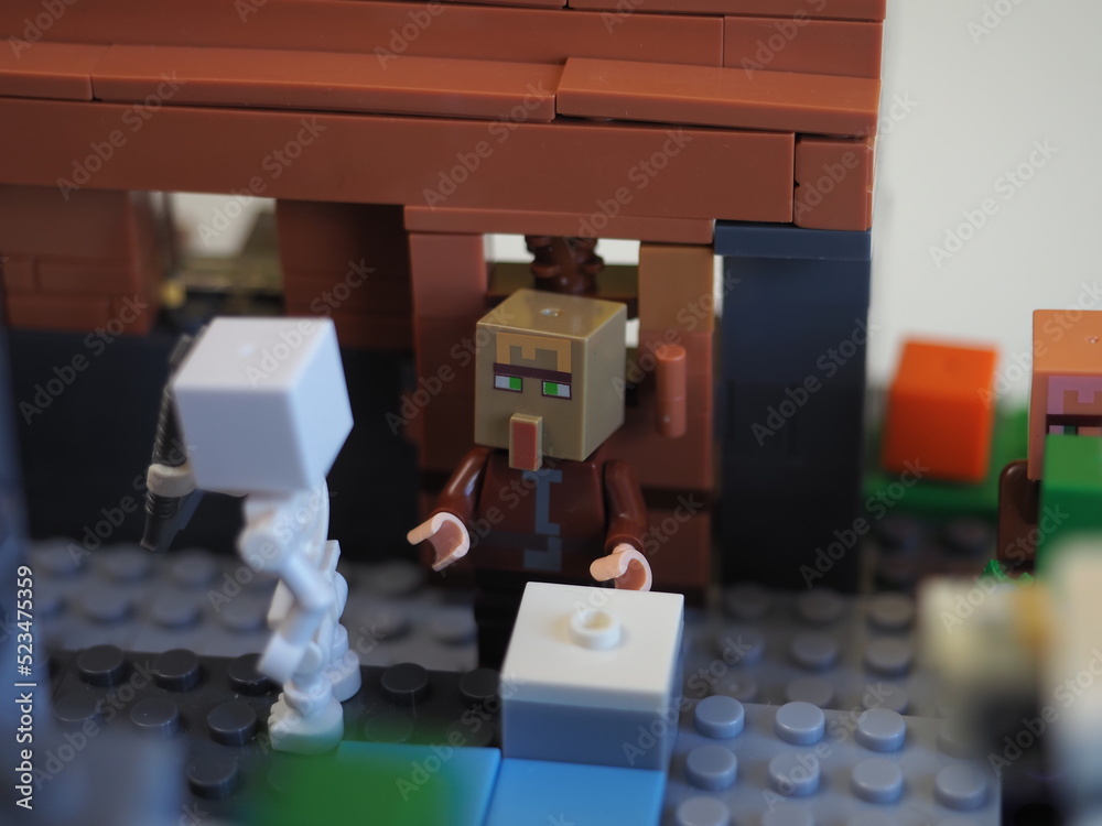 Fototapeta premium Elements and fragments of Lego village world set. Characters of electronic game Minecraft. Children's designer with small details, developing motor skills and imagination.