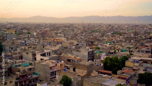 Slow Motion kite flying festival Basant in Pakistan in the evening with city from the top view