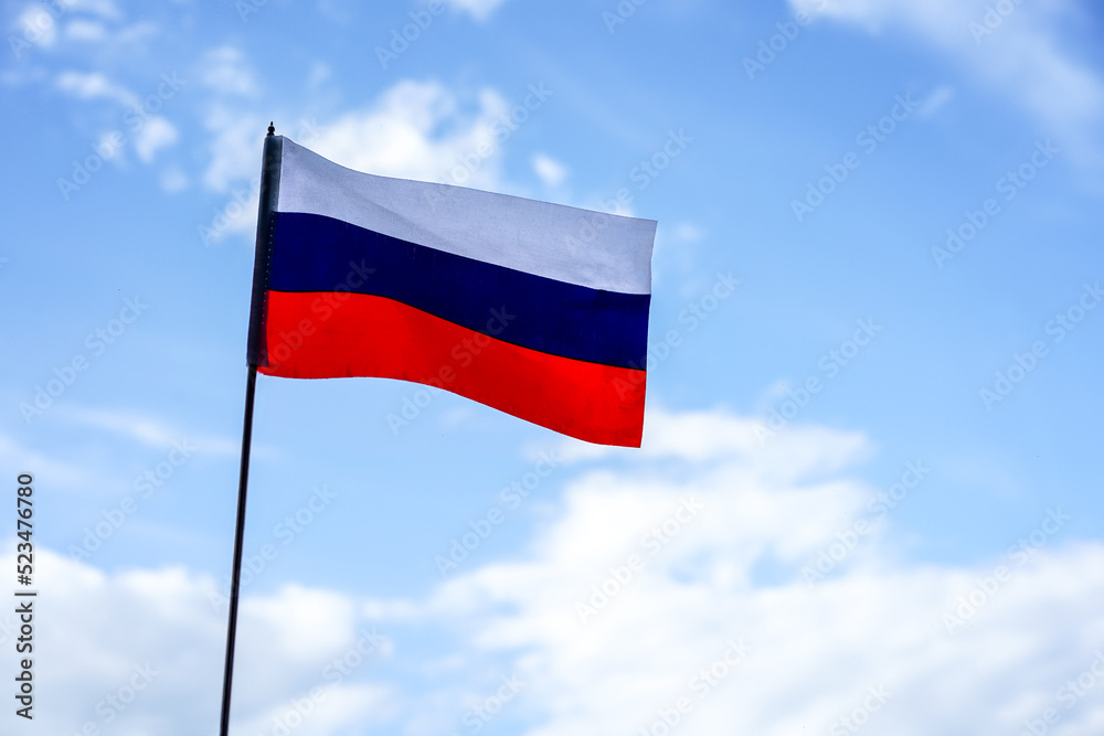 Flag of Russia on blue sky background. Patriotism, Russia day Flag of Russia on blue sky background. Patriotism, Russia day
