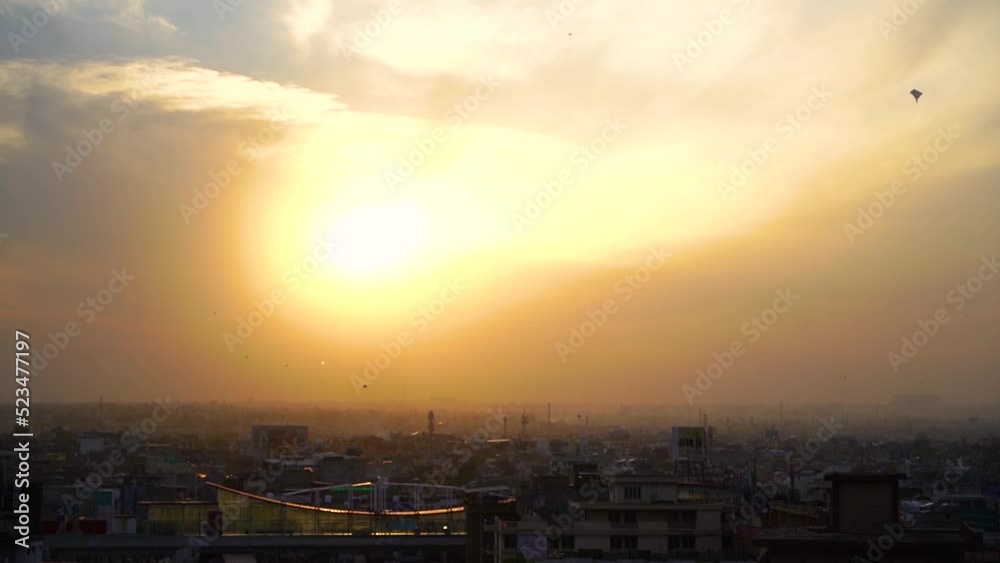 Slow Motion kite flying festival Basant in Pakistan in the evening with city from the top view Slow Motion kite flying festival Basant in Pakistan in the evening with city from the top view