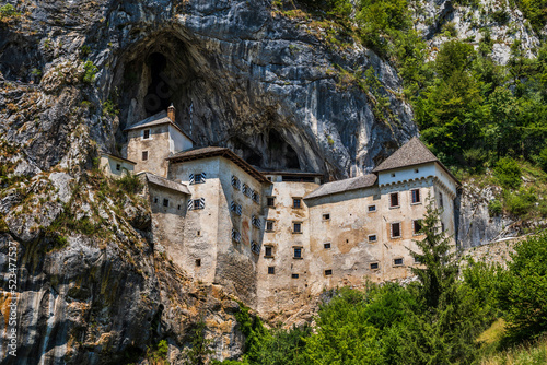 Slovenia, Predjama, Predjama Castle standing within cave mouth photo