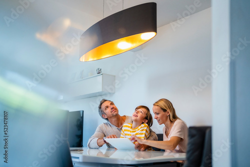 Family controlling ceiling lamp with tablet PC in Smart Home