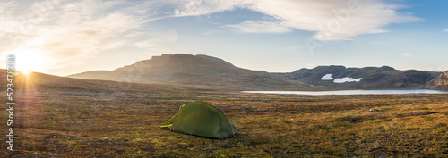 Norway, Lone tent pitched on plateau in Hardangervidda National Park at sunrise photo
