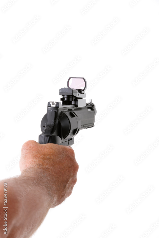 Man shooting with revolver against white background Man shooting with revolver against white background