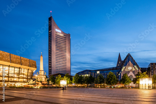 Germany, Saxony, Leipzig, Augustusplatz at dusk with City-Hochhaus, Gewandhaus and Paulinum in background photo
