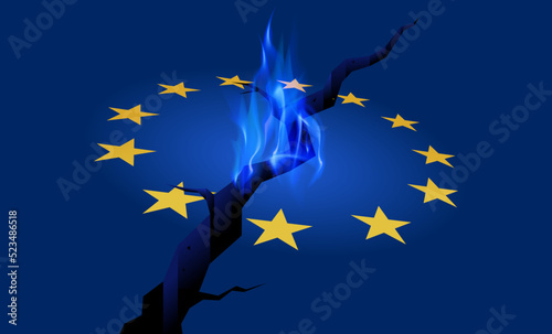 EU energy shortage and economy crisis. Natural gas flame on cracked and burning European Union flag