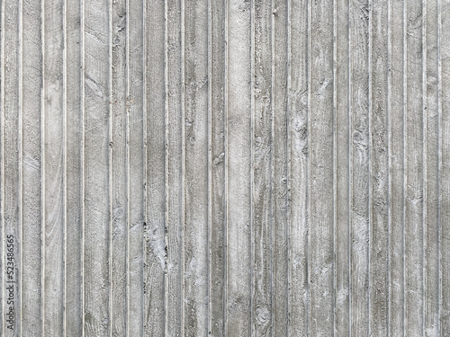 Close-up of a precast tilt slap concrete wall background with wood texture