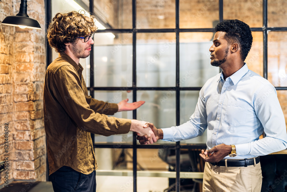 Image two business partner meeting successful handshake together with success join congratulation good deal contract in modern office.Partnership approval and teamwork concept Image two business partner meeting successful handshake together with success join congratulation good deal contract in modern office.Partnership approval and teamwork concept