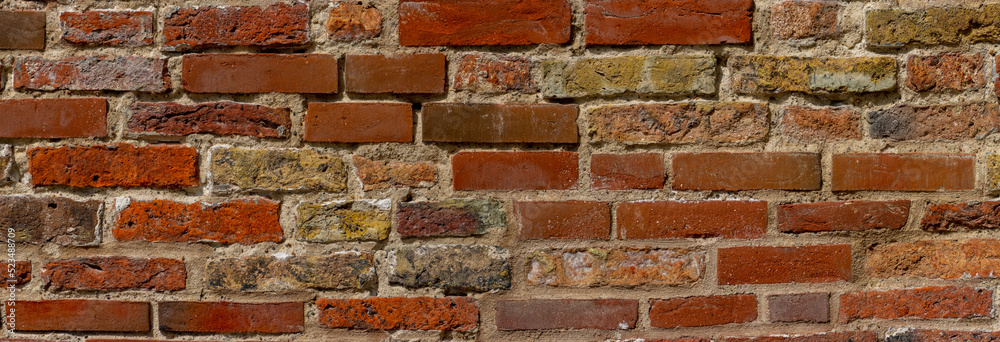 Fototapeta premium Wide weathered red brick wall background