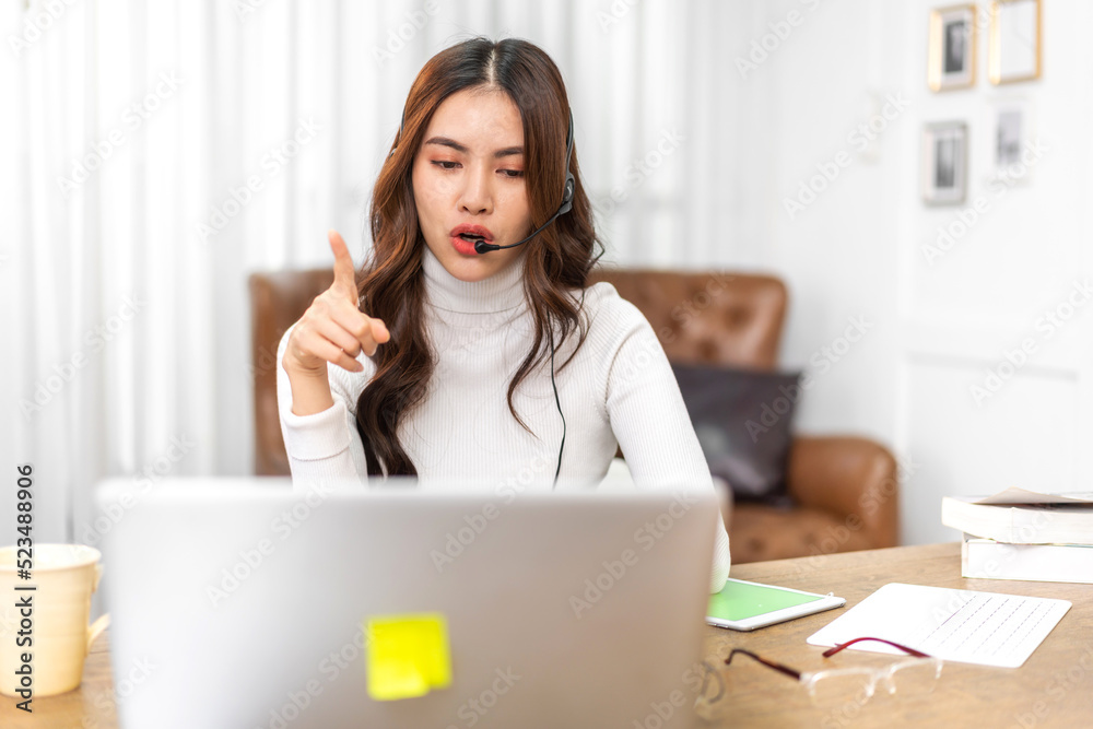 Woman talk speak using laptop computer working and video conference online meeting with colleagues at home.Creative woman talk video chat call with business team.work from home concept Woman talk speak using laptop computer working and video conference online meeting with colleagues at home.Creative woman talk video chat call with business team.work from home concept