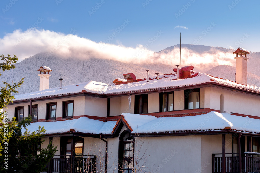 Winter house in mountain snow landscape