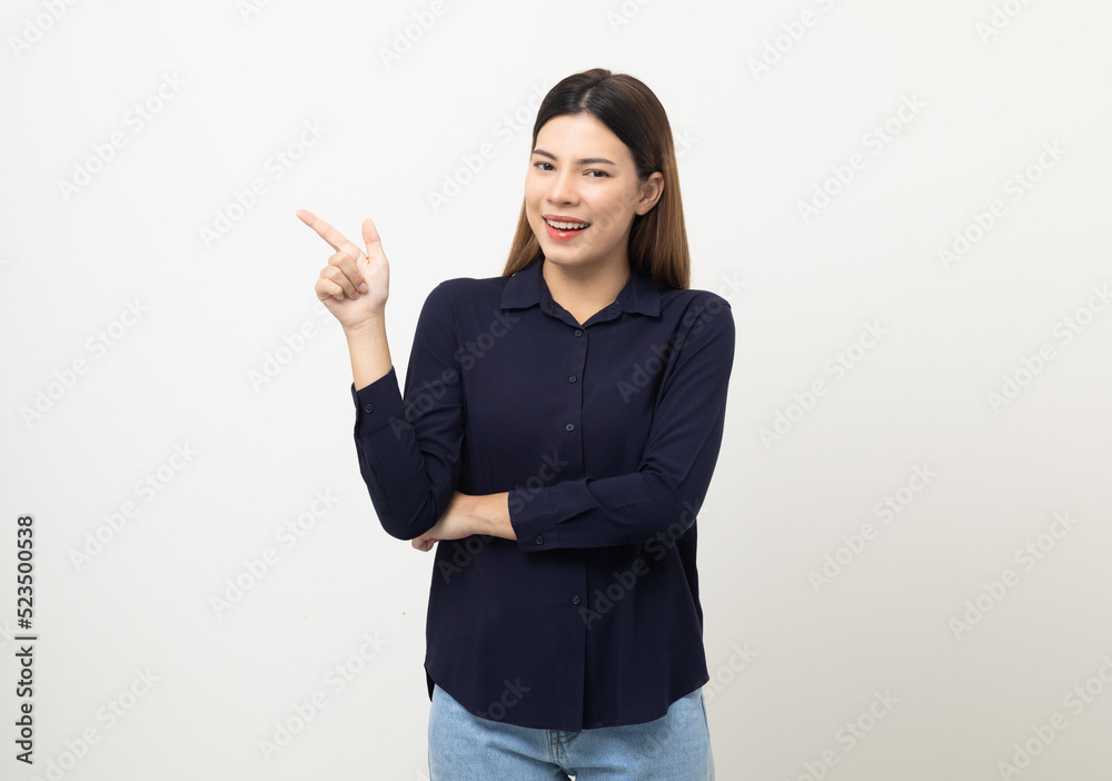 Young beautiful woman pointing finger to copyspace. Happy cheerful female on isolated white background. Pointing to blank space for advertise text. Young beautiful woman pointing finger to copyspace. Happy cheerful female on isolated white background. Pointing to blank space for advertise text.