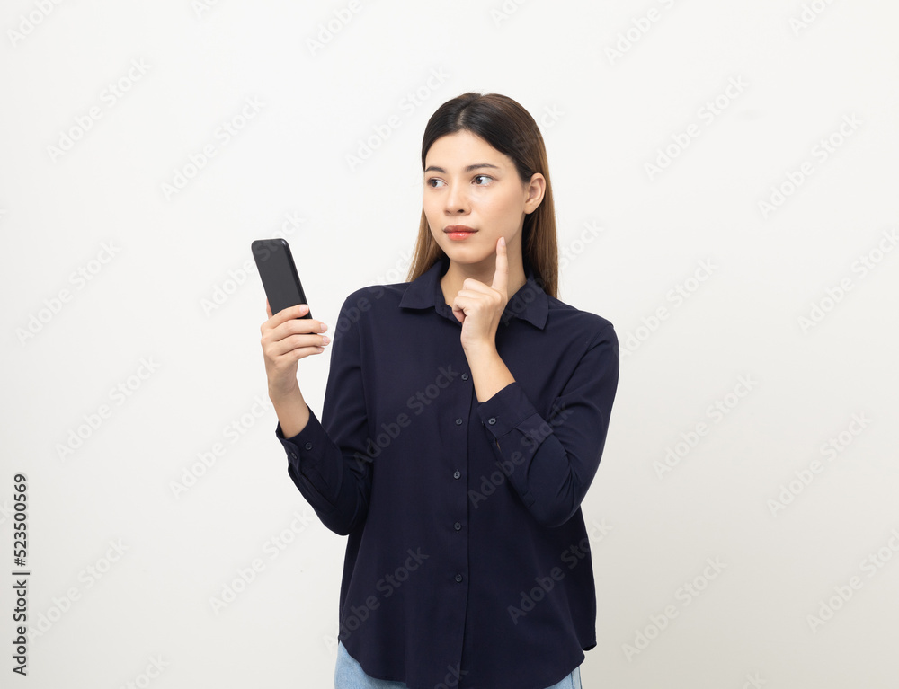 Pretty young mixed race woman using smartphone standing on isolated white background. She texting on cell phone. Feeling happy and excited Pretty young mixed race woman using smartphone standing on isolated white background. She texting on cell phone. Feeling happy and excited