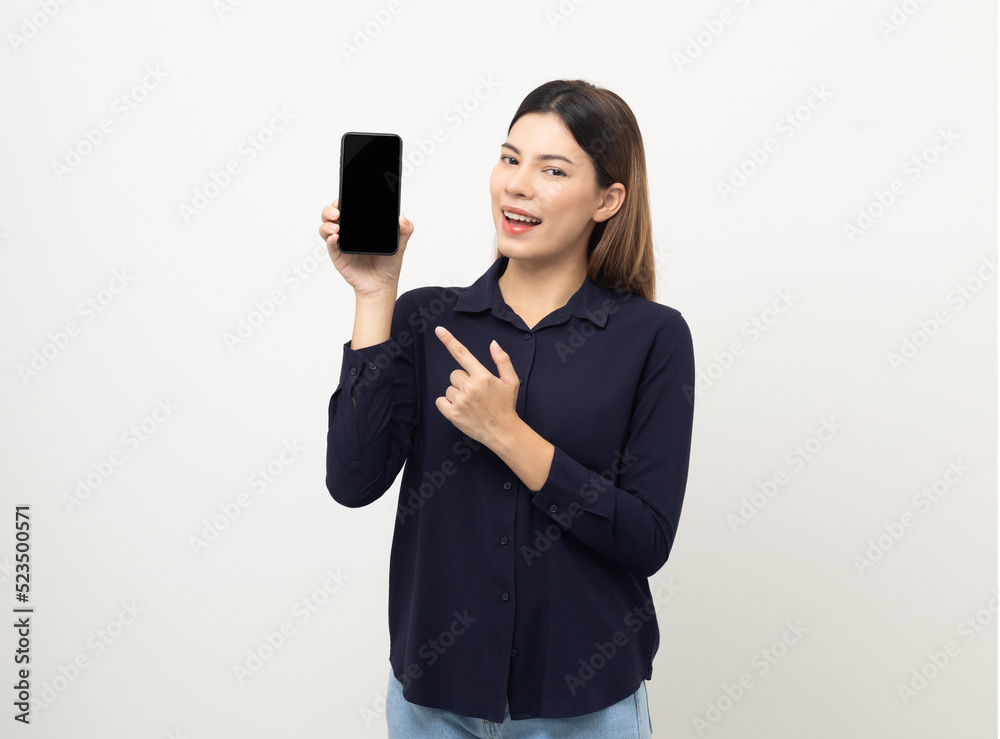 Pretty young mixed race woman using smartphone standing on isolated white background. She texting on cell phone. Feeling happy and excited Pretty young mixed race woman using smartphone standing on isolated white background. She texting on cell phone. Feeling happy and excited