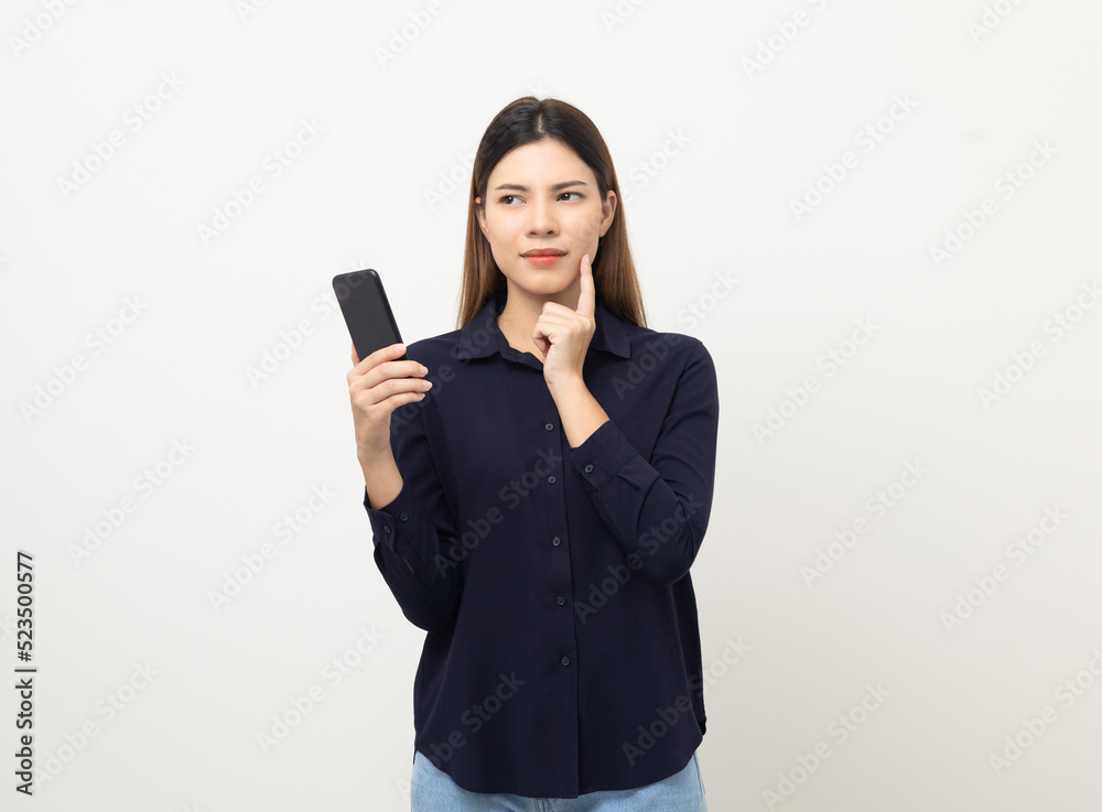 Pretty young mixed race woman using smartphone standing on isolated white background. She texting on cell phone. Feeling happy and excited Pretty young mixed race woman using smartphone standing on isolated white background. She texting on cell phone. Feeling happy and excited