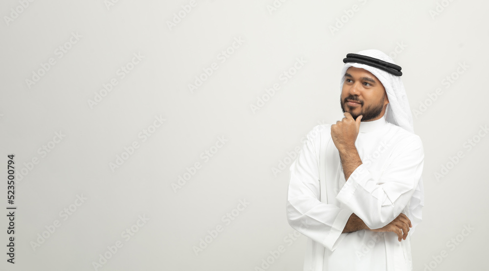 Portrait of arabic man with kandura dress on isolated white background. Arab business people thinking. Portrait of arabic man with kandura dress on isolated white background. Arab business people thinking.