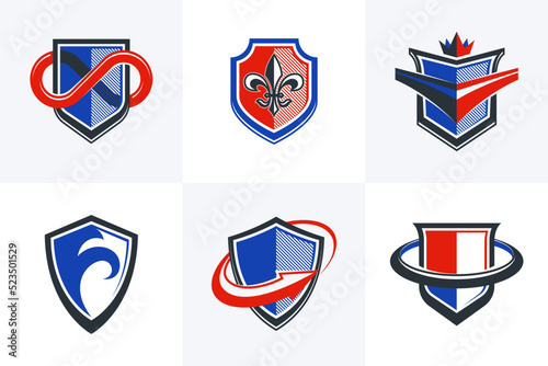 Classic shields shapes set with different additional elements vector symbols set, defense and safety icons, ammo emblems collection.