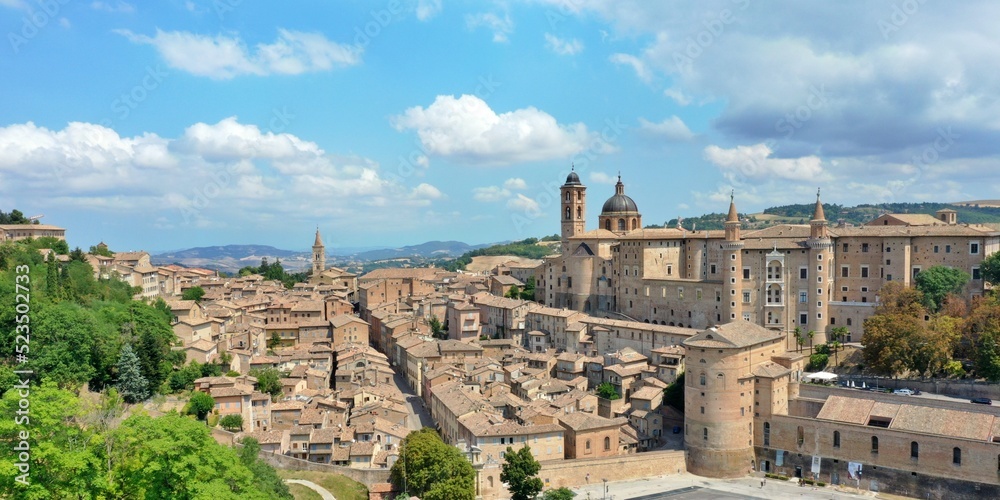 Aerial view of Urbino with the Ducal Palace of Urbino built by Federico da Montefeltro in the center. Urbino, Pesaro and Urbino, Italy 