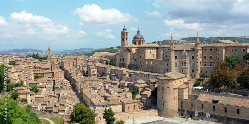 Aerial view of Urbino with the Ducal Palace of Urbino built by Federico da Montefeltro in the center. Urbino, Pesaro and Urbino, Italy 
