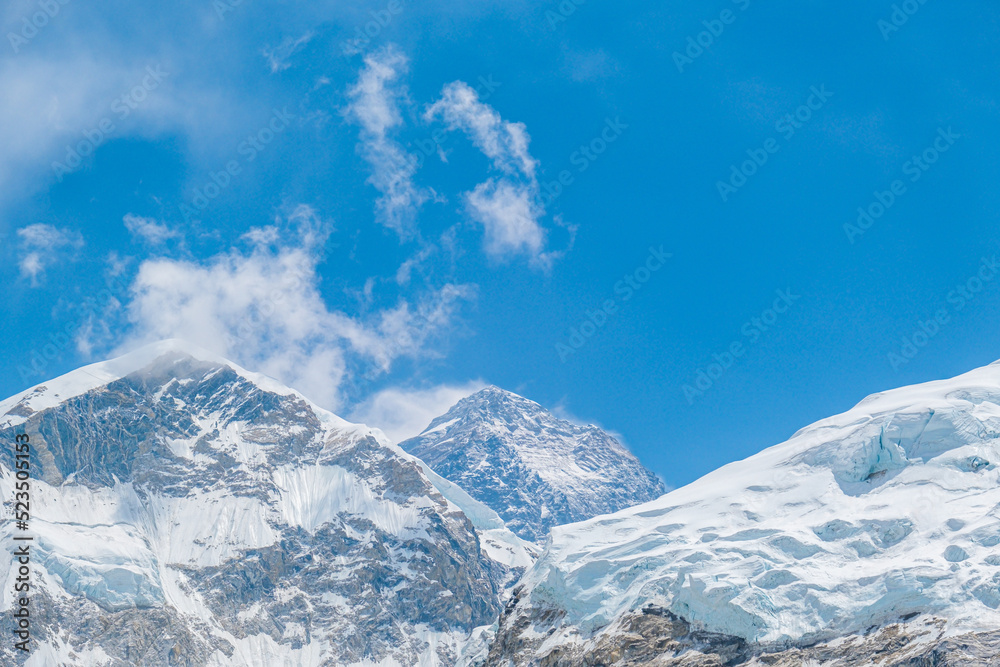 Obraz premium View from Mount Everest base camp, tents and prayer flags, Sagarmatha national park, Khumbu valley, Nepal trekking, Himalaya tourism