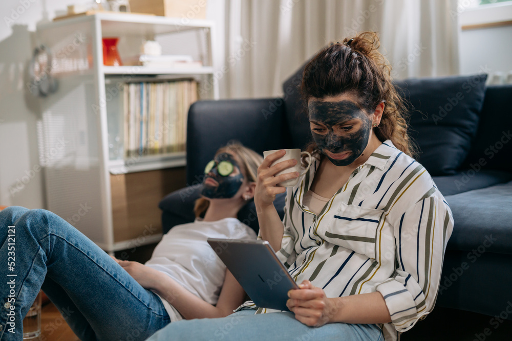 mother and daughter with cosmetic face mask at home mother and daughter with cosmetic face mask at home