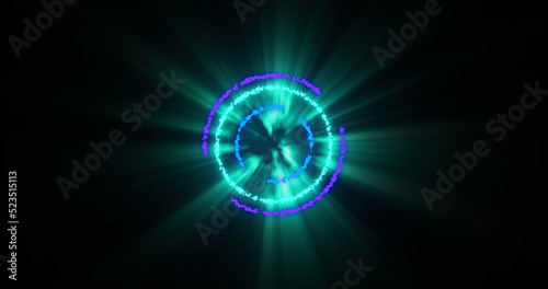 Image of glowing green, blue and purple circles over black background