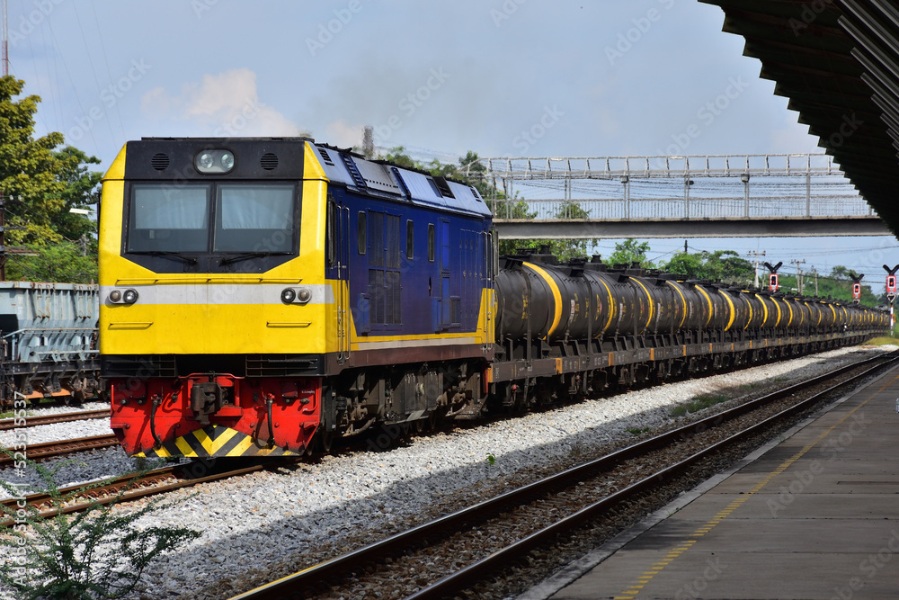 Fototapeta premium Tanker-freight train by diesel locomotive on the railway.