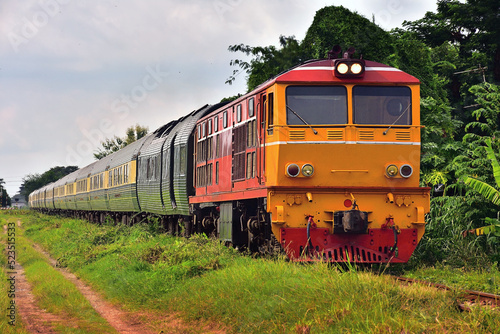 Passenger train by diesel locomotive on the railway