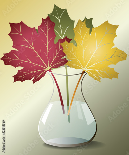 Colorful autumn leaves in a glass vase